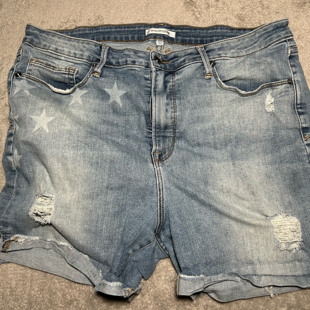 Good American Distressed Denim Shorts with Star Accents